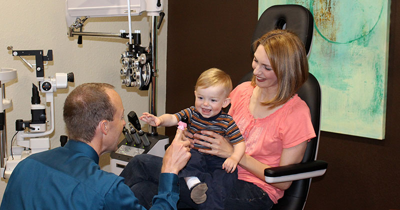 Doctor performing a pediatric eye exam